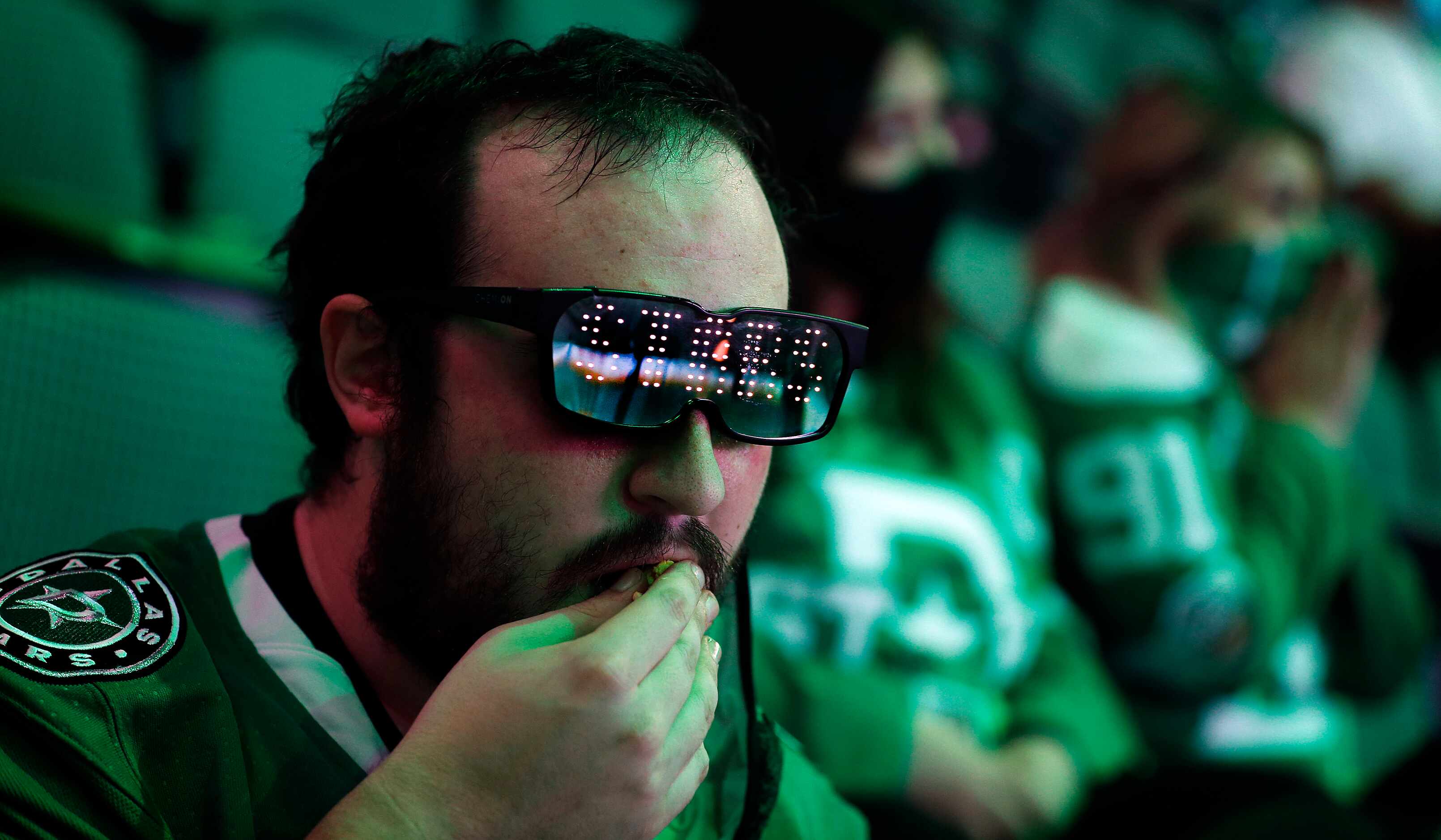 Dallas Stars fan Dale Muir pf Dlals donned a pair of LED sunglasses flashing his favorite...