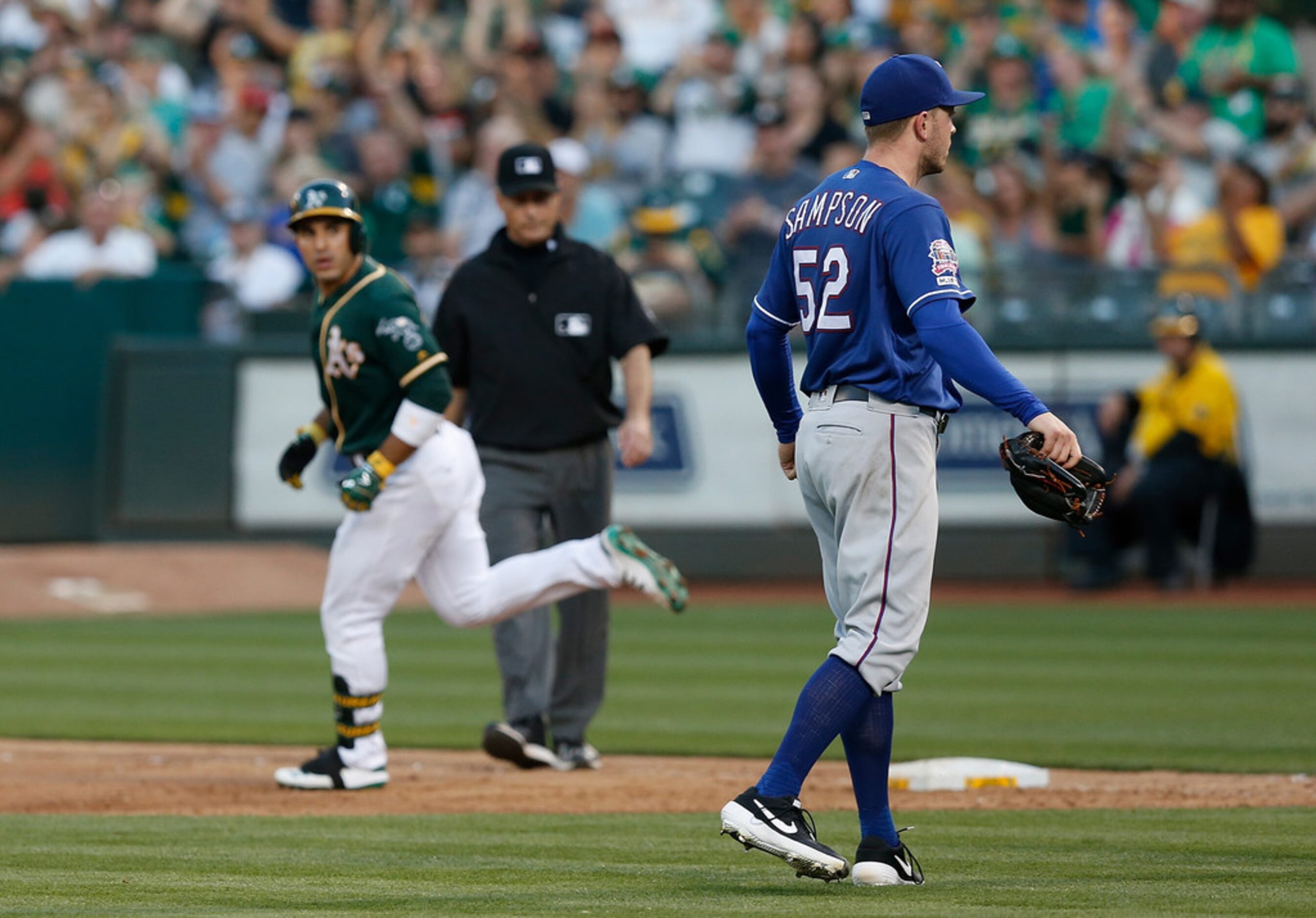 OAKLAND, CALIFORNIA - JULY 27: Ramon Laureano #22 of the Oakland Athletics has words with...