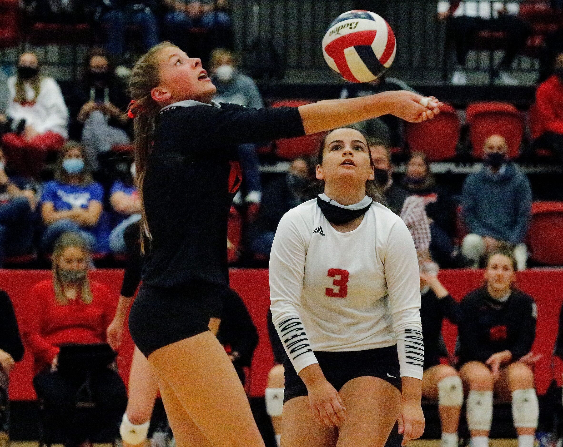 Lovejoy High School setter Rosemary Archer (17) saves a play in front of Lovejoy High School...