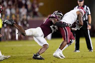 Texas A&M defensive back Demani Richardson (26) stops South Carolina running back MarShawn...