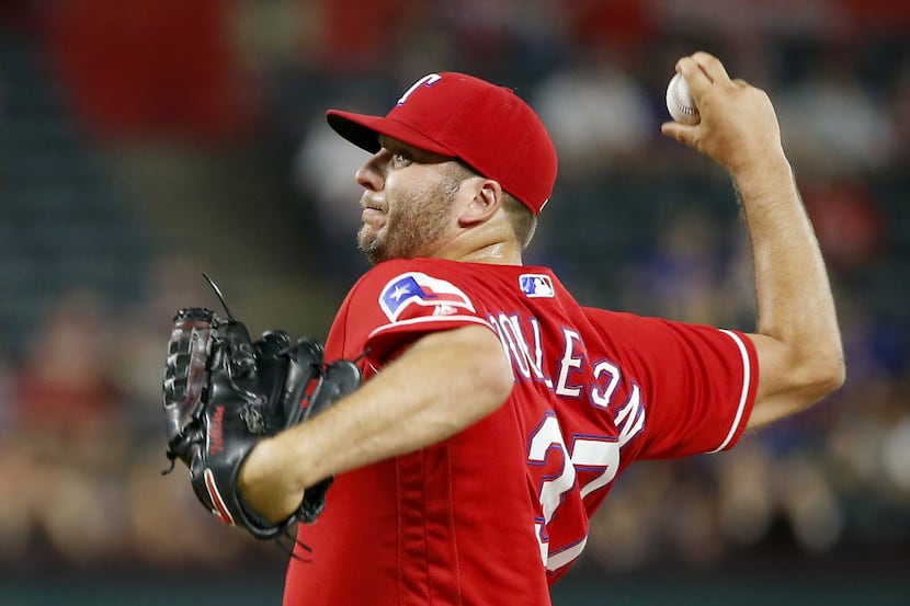 Texas Rangers relief pitcher Shawn Tolleson throws a pitch against Oakland Athletics during...