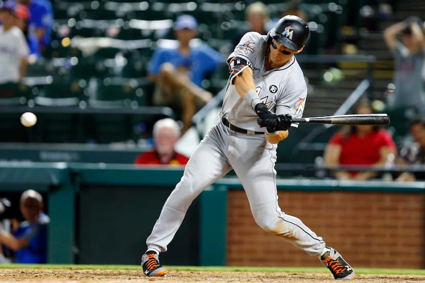 Miami Marlins Derek Dietrich (32) tries to time his swing for a sub-50 mph pitch form Texas...