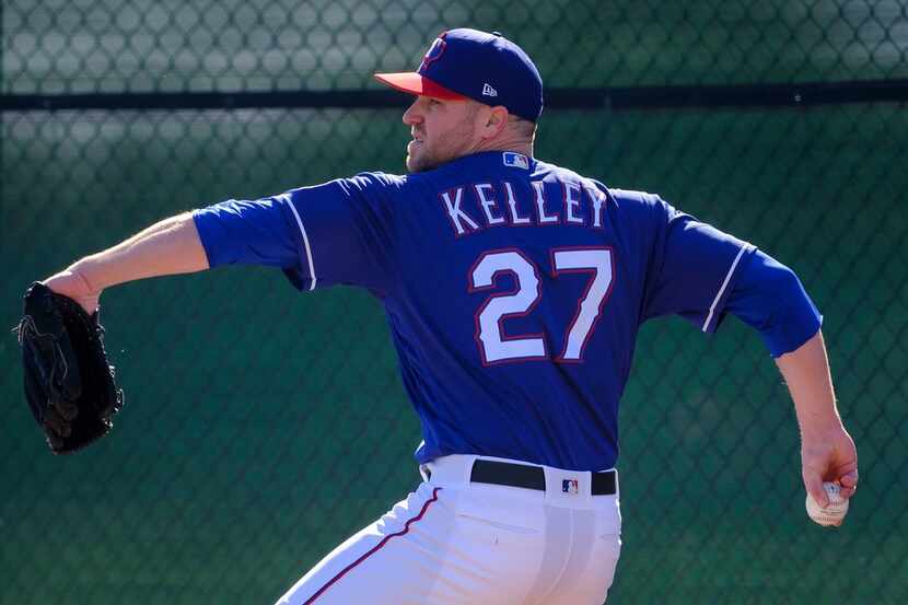 Texas Rangers pitcher Shawn Kelley throws in the bullpen during a spring training workout at...