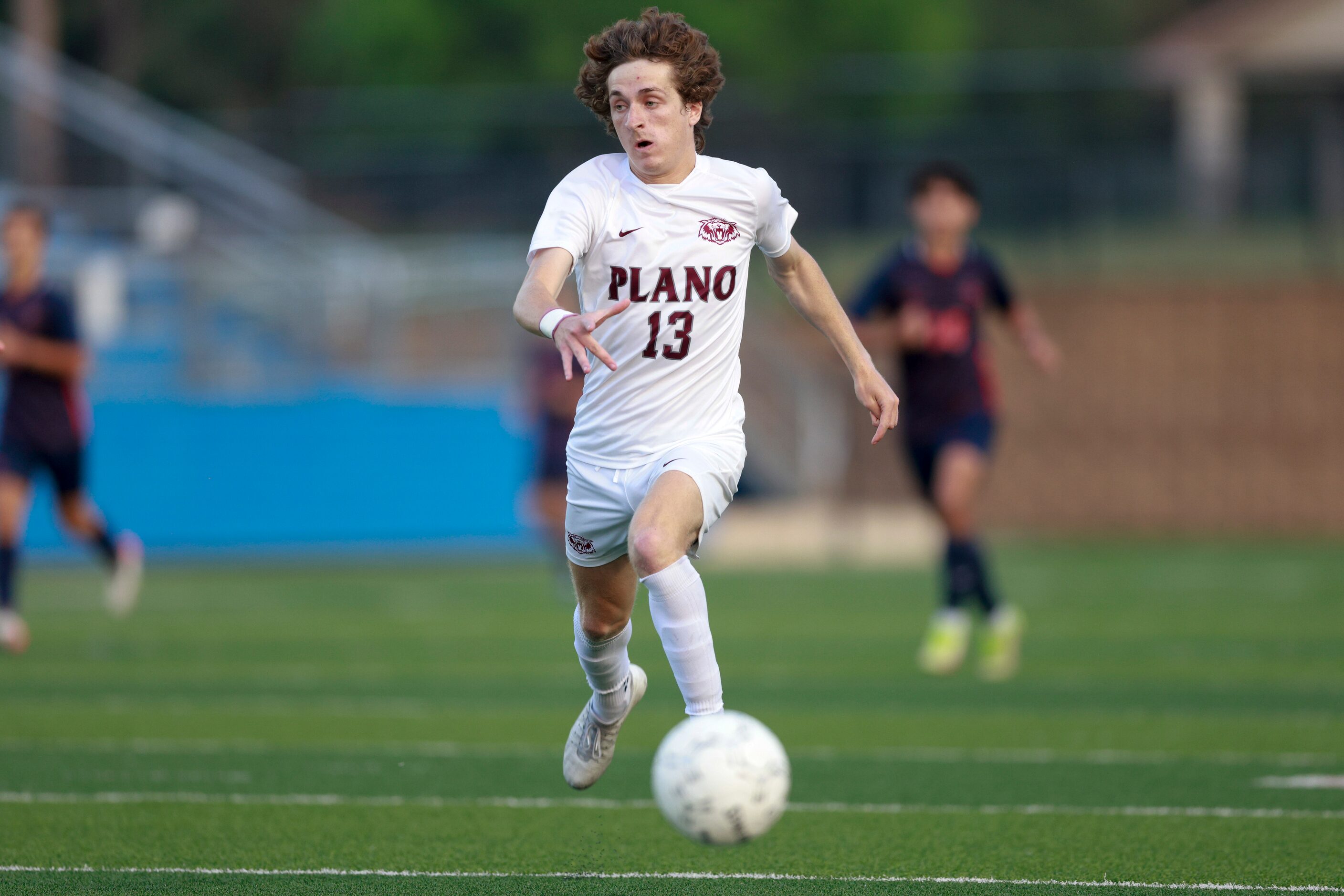 Plano forward Aaron Myers (13) dribbles down the field during the first half of a Class 6A...