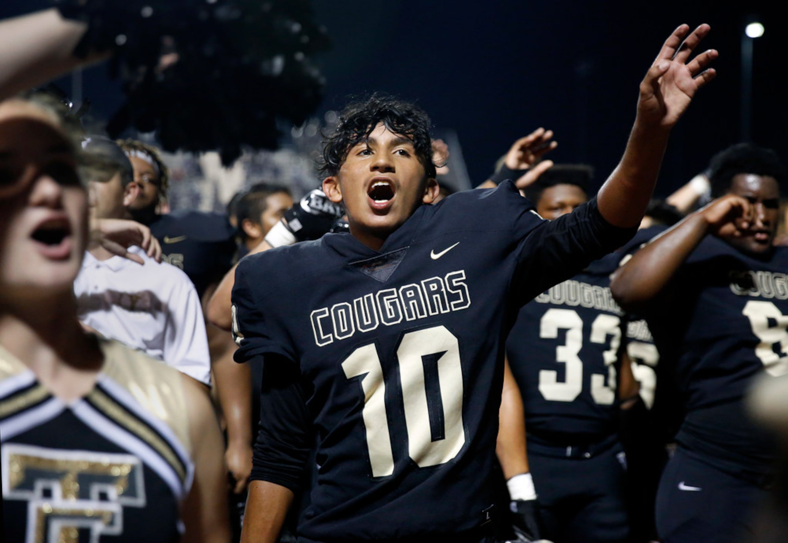 The Colony linebacker Gage Guerra (10) sings the school song with teammates and cheerleaders...