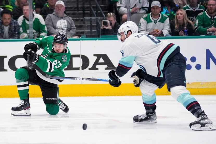 Dallas Stars right wing Evgenii Dadonov (63) has his shot deflected by Seattle Kraken...