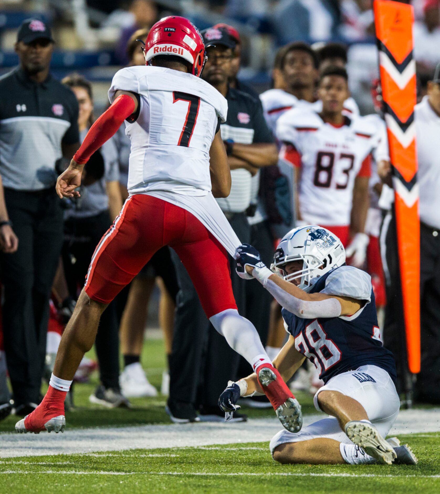 Cedar Hill quarterback Kaidon Salter (7) is taken down by Allen defensive back Will Drogosch...