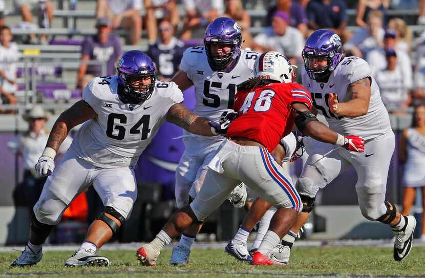 TCU Horned Frogs Matt Pryor (64), Austin Schlottmann (51) and Patrick Morris (58) close in...