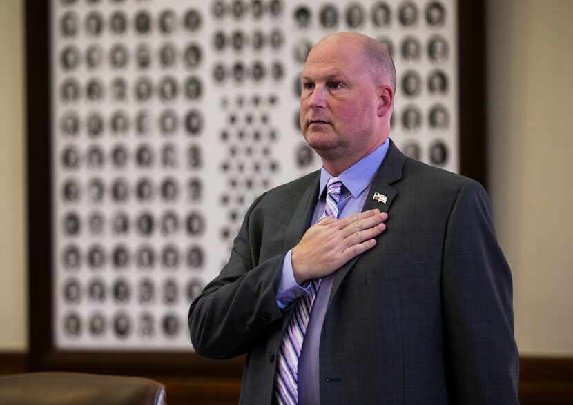 Texas Rep. Tony Tinderholt recites the Pledge of Allegiance on the third day of the 86th...