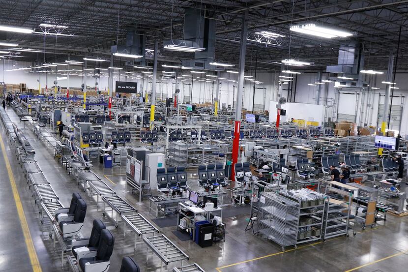Recaro employees work in the factory assembling aircraft seats on Tuesday, Sept. 12, in Fort...