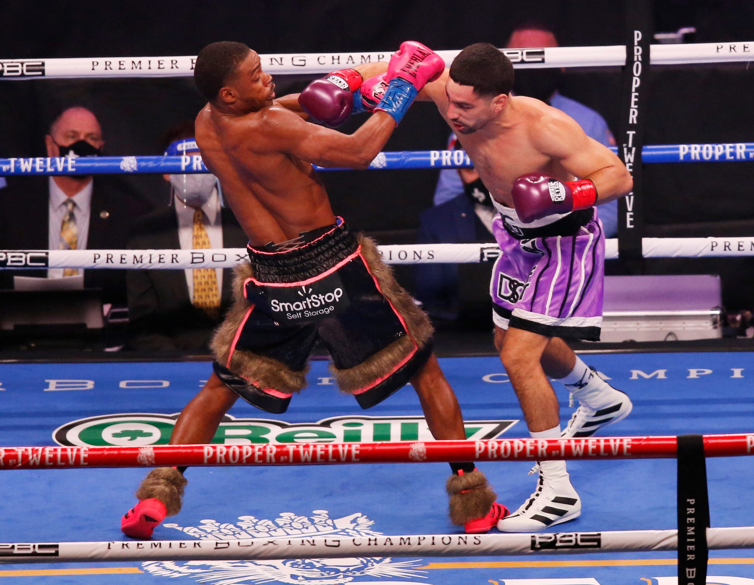 Errol Spence, Jr. and Danny García fight during the first round of a WBC & IBF World...