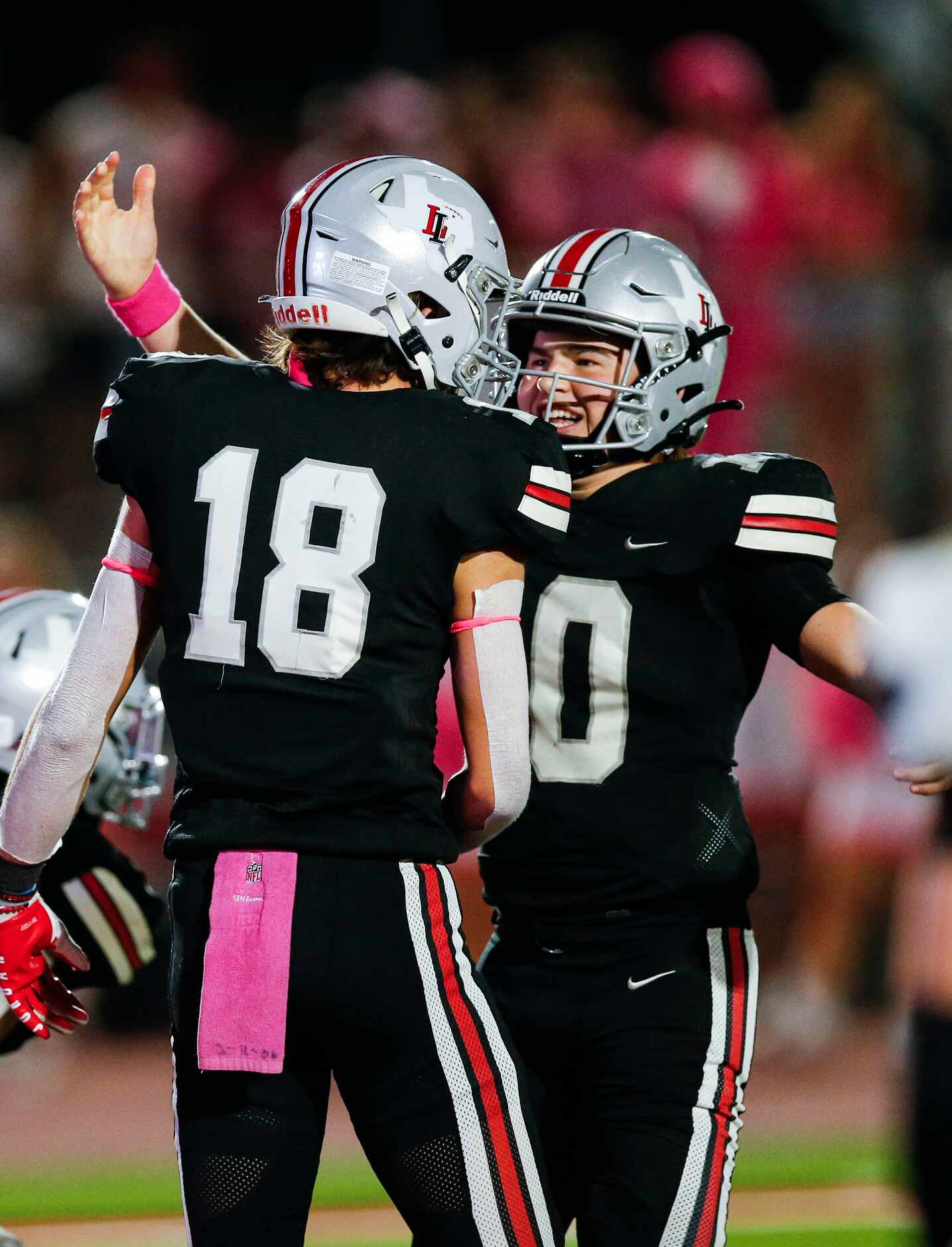 Lovejoy sophomore wide receiver Parker Livingstone (18) is congratulated by sophomore...