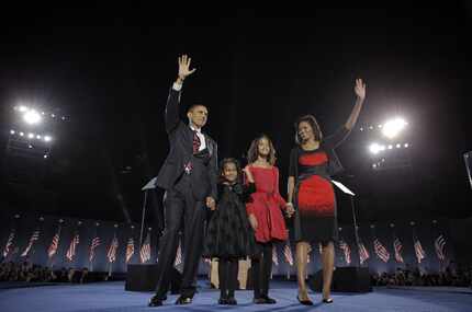 In this Nov. 4, 2008 file photo, President-elect Barack Obama, left, his wife Michelle...