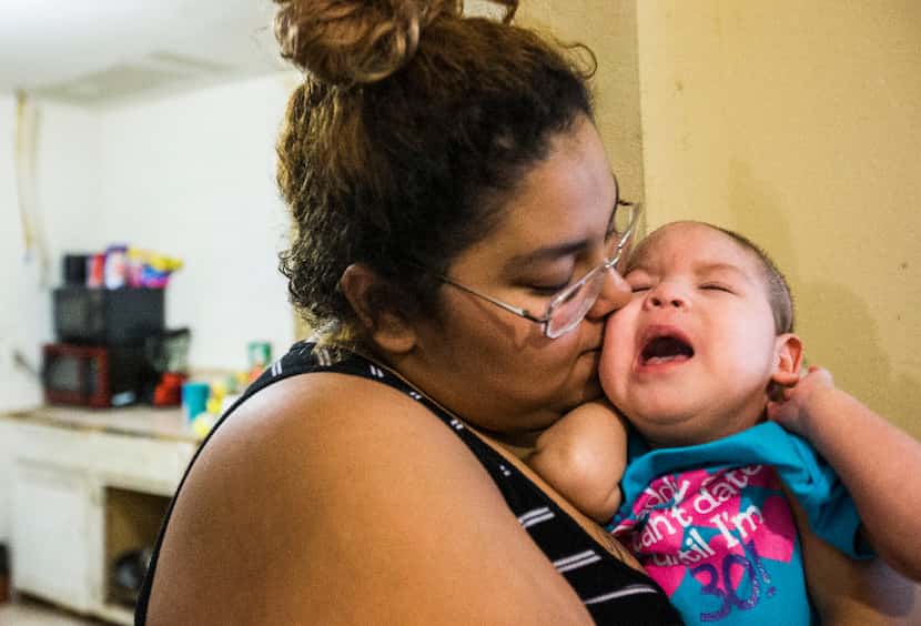 Alexandra Maldonado, 18, kissed her daughter, Delilah Palma, 1, who suffers from a condition...