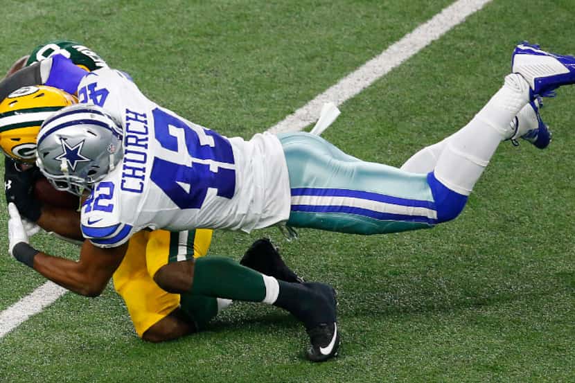 Dallas Cowboys strong safety Barry Church (42) tackles Green Bay Packers running back Ty...