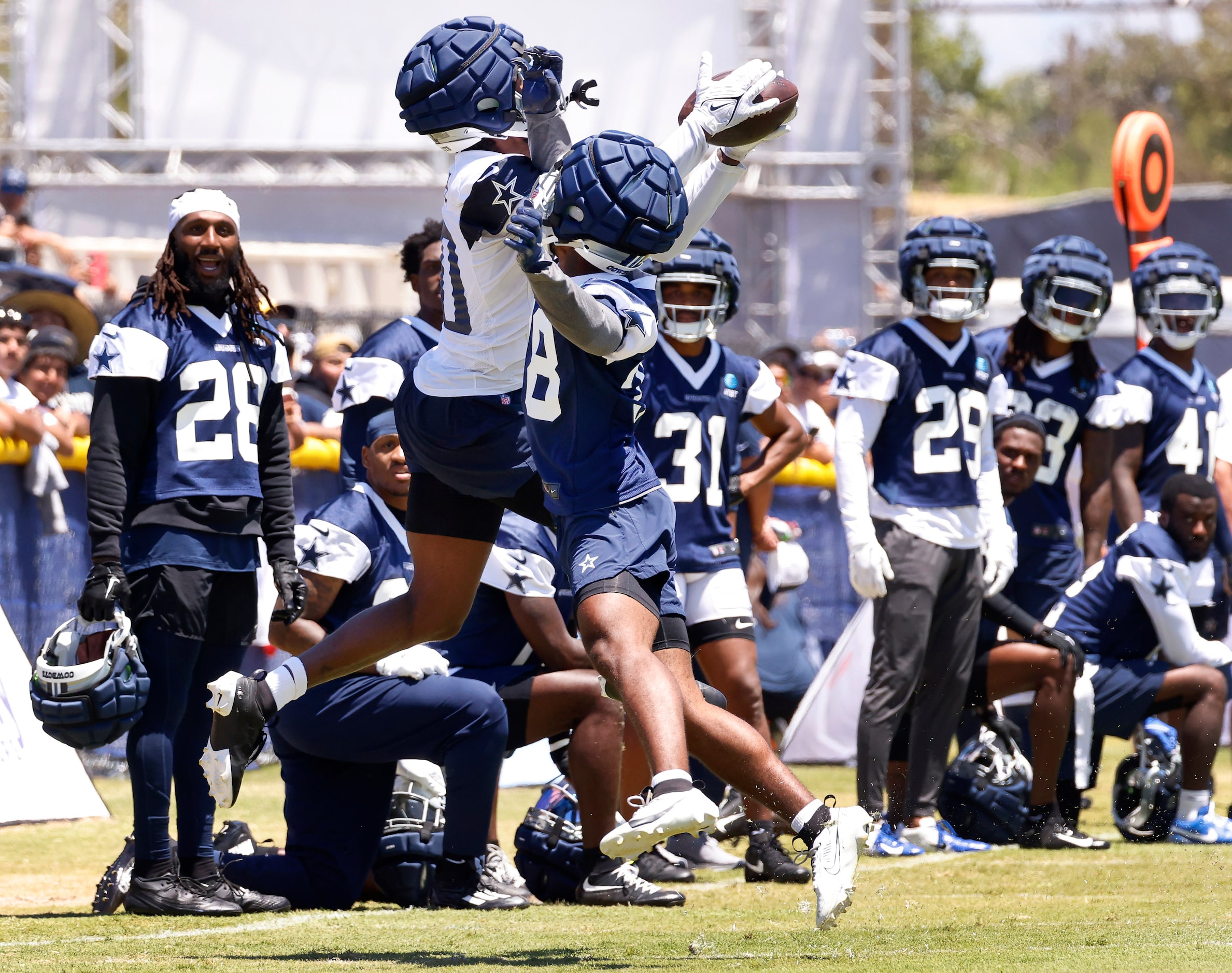 Dallas Cowboys cornerback Josh DeBerry (38) defends wide receiver Racey McMath (80) who went...