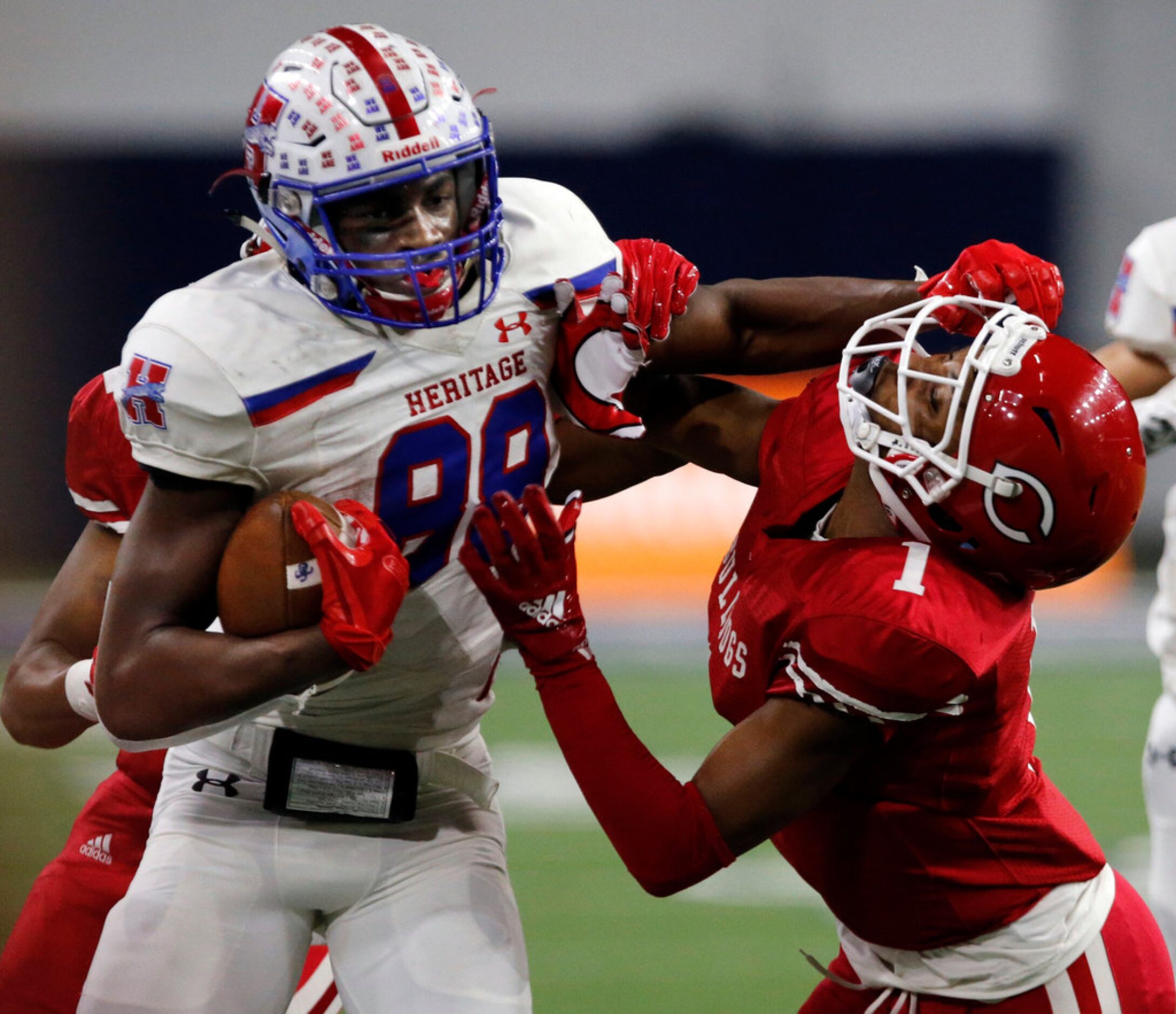 Midlothian Heritage's Langston Anderson (88) picks up a first down at the expense of...