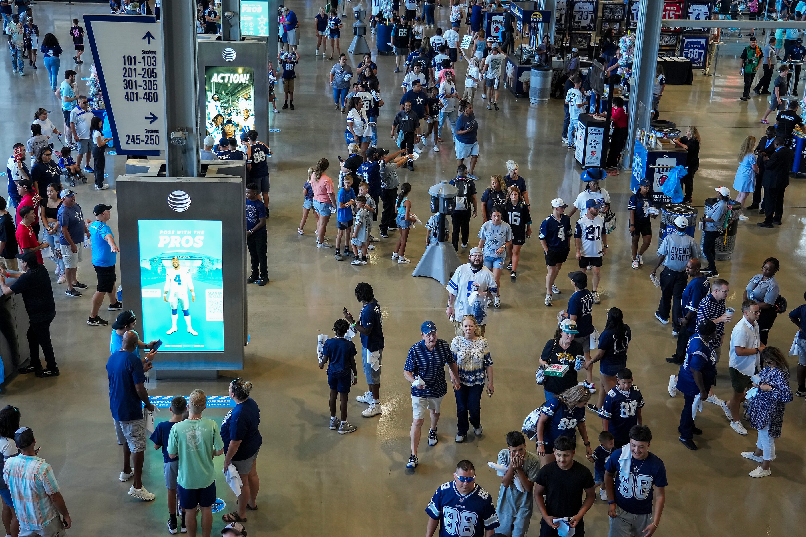 Fans head into the stadium before an NFL preseason football game between the Dallas Cowboys...