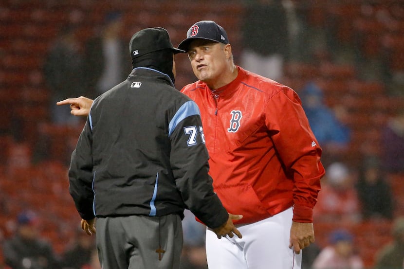 Boston Red Sox manager John Farrell (53) argues with umpire Alfonso Marquez (72) during the...