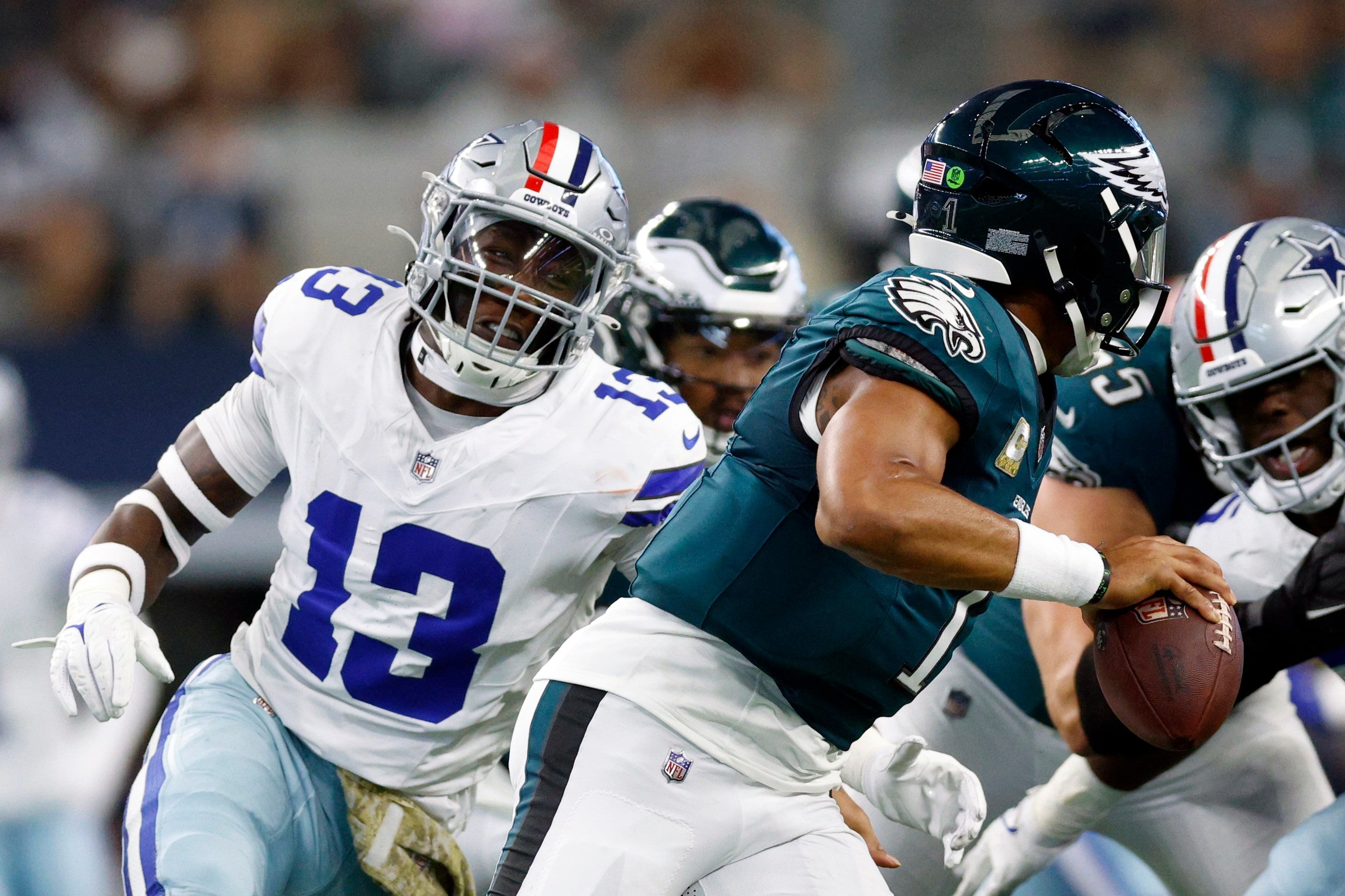 Dallas Cowboys linebacker DeMarvion Overshown (13) pursues Philadelphia Eagles quarterback...