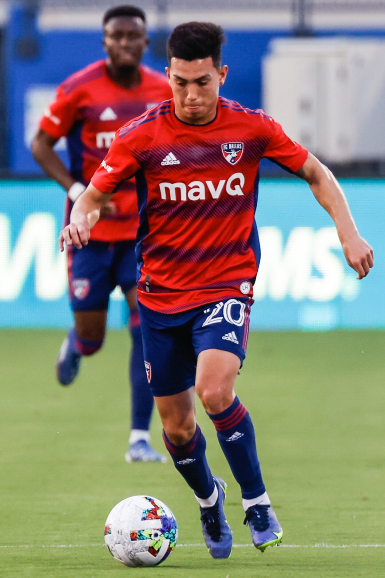 FC Dallas forward Alan Velasco (20) goes with the ball during the first half against the New...