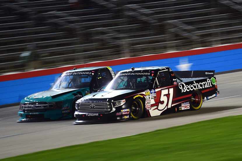 FORT WORTH, TX - MARCH 29:  Kyle Busch, driver of the #51 Cessna Toyota, races Johnny...