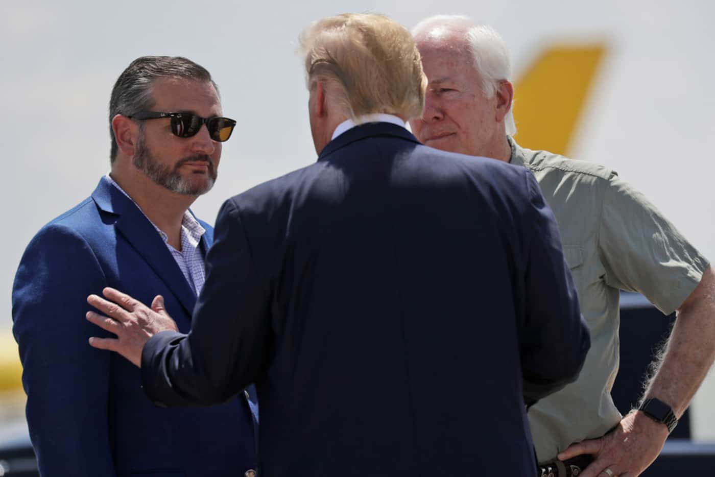 Sens. Ted Cruz (left) and John Cornyn greet Donald Trump upon his arrival in El Paso.