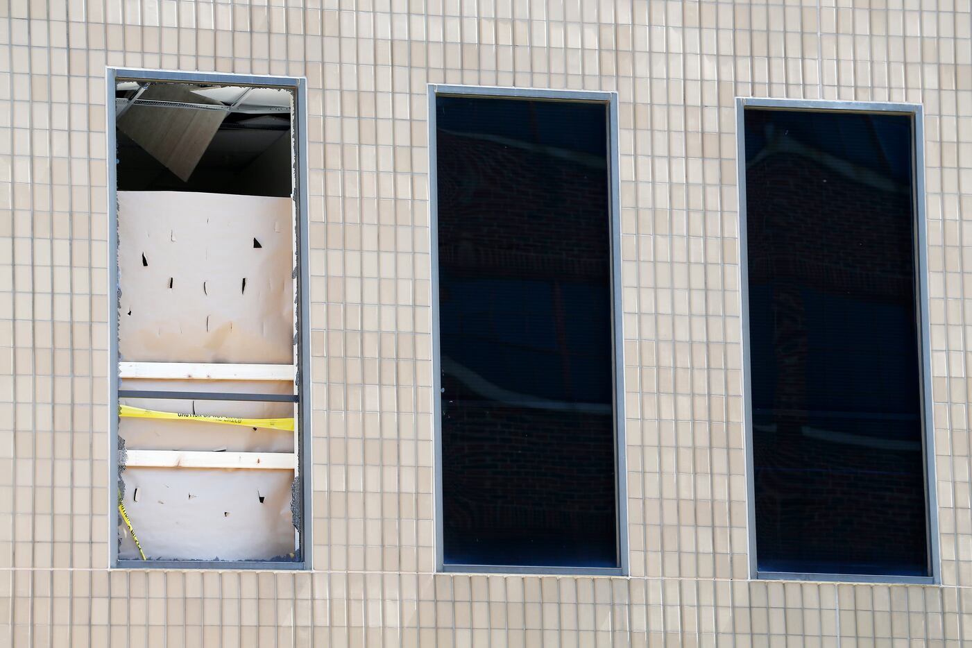 A broken window of a room close to the area where Micah Johnson was holed up and killed on...
