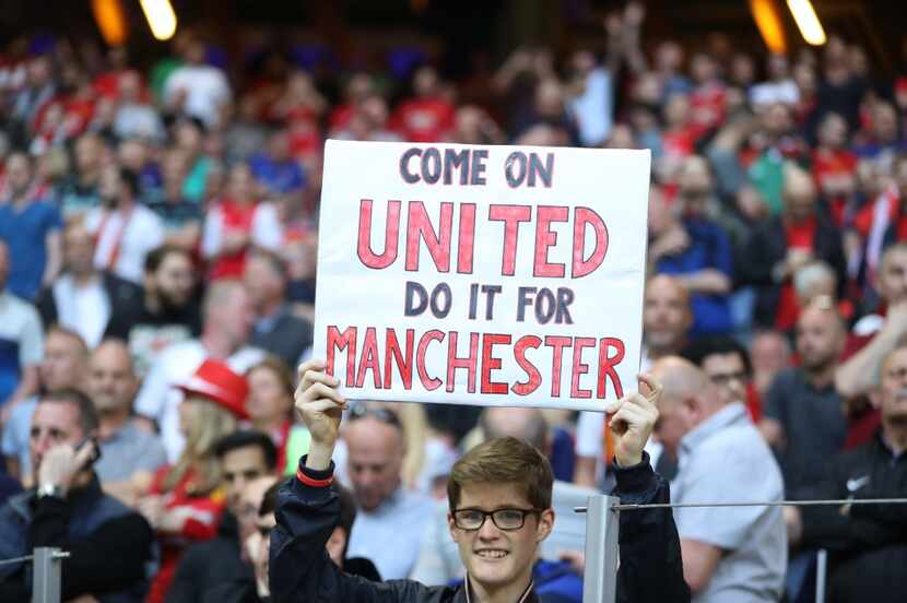 A supporter of Manchester United cheers before the UEFA Europa League final football match...