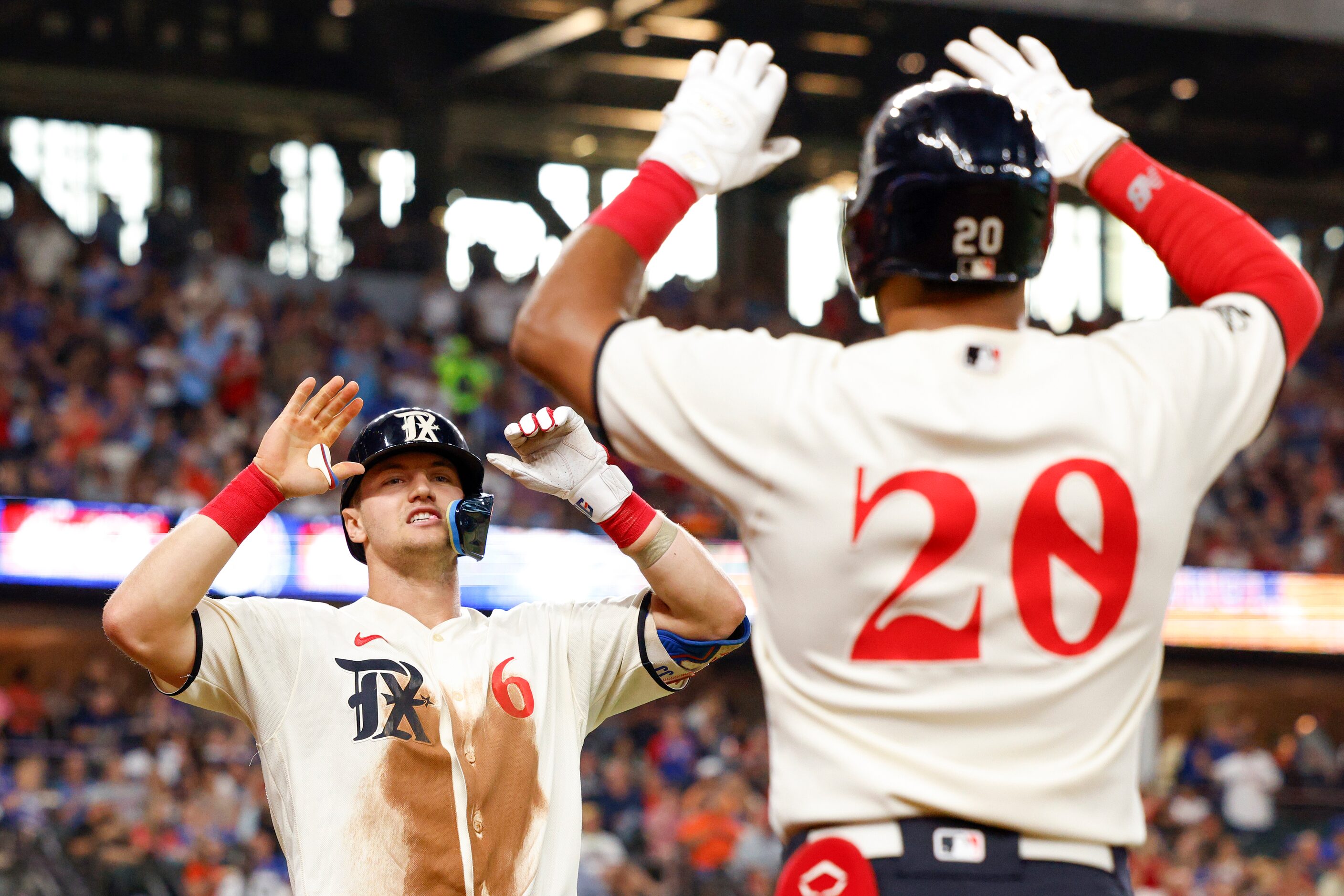 Texas Rangers third baseman Josh Jung (6) celebrates his home run with designated hitter...