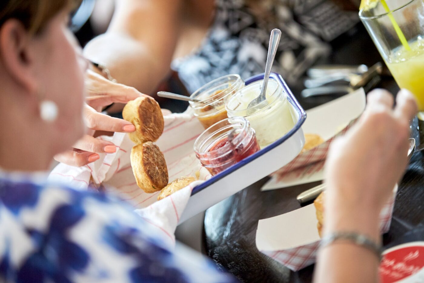 Guests sample biscuits and various jams during a pop-up brunch held by Hot Box Biscuits Club...