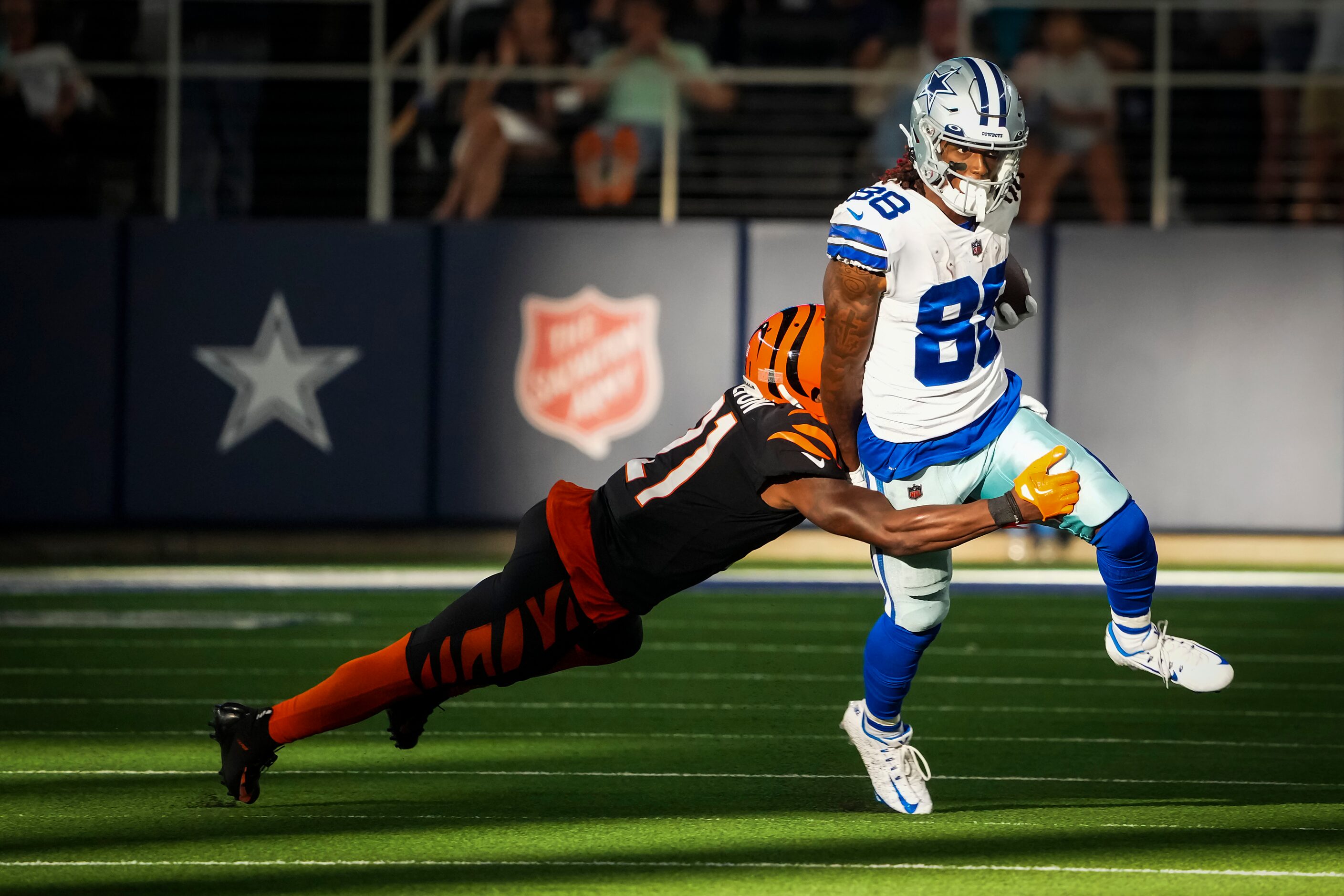 Dallas Cowboys wide receiver CeeDee Lamb (88) picks up a first down past Cincinnati Bengals...