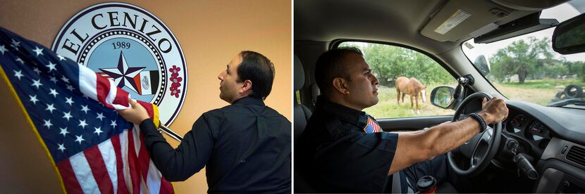 Raul Reyes, (left) Mayor of El Cenizo, Texas, places the American flag next to the city seal...