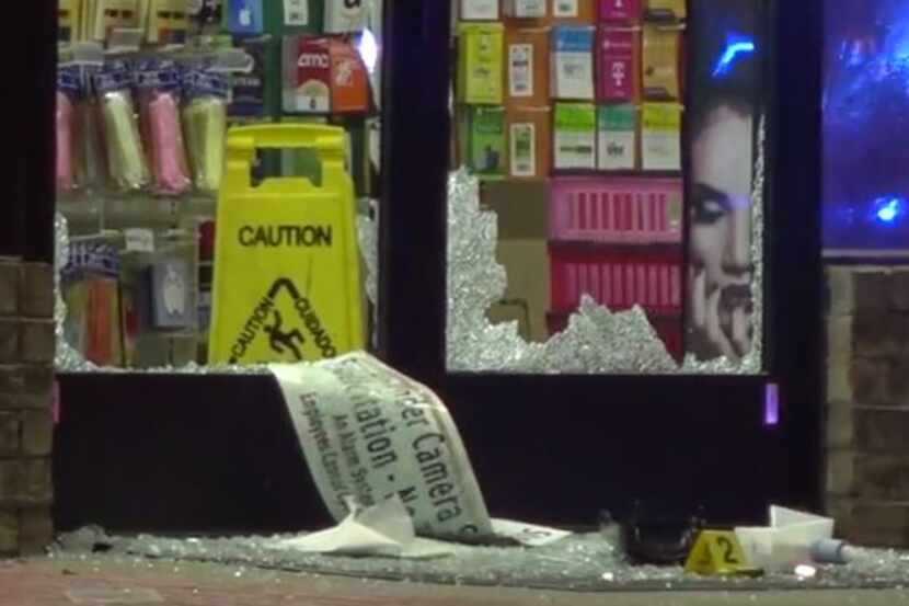 The windows of the front door of an Irving 7-11 were shattered Thursday morning after an...