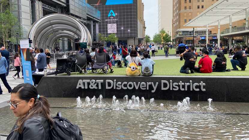 Crowds being to fill the AT&T Discovery District in downtown Dallas on eclipse day, April 8,...
