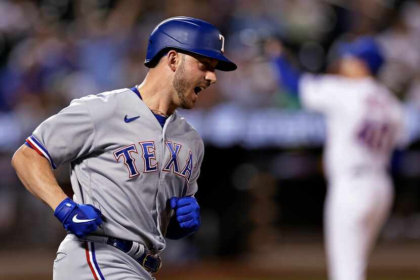 Texas Rangers designated hitter Mitch Garver runs the bases on a home run against the New...