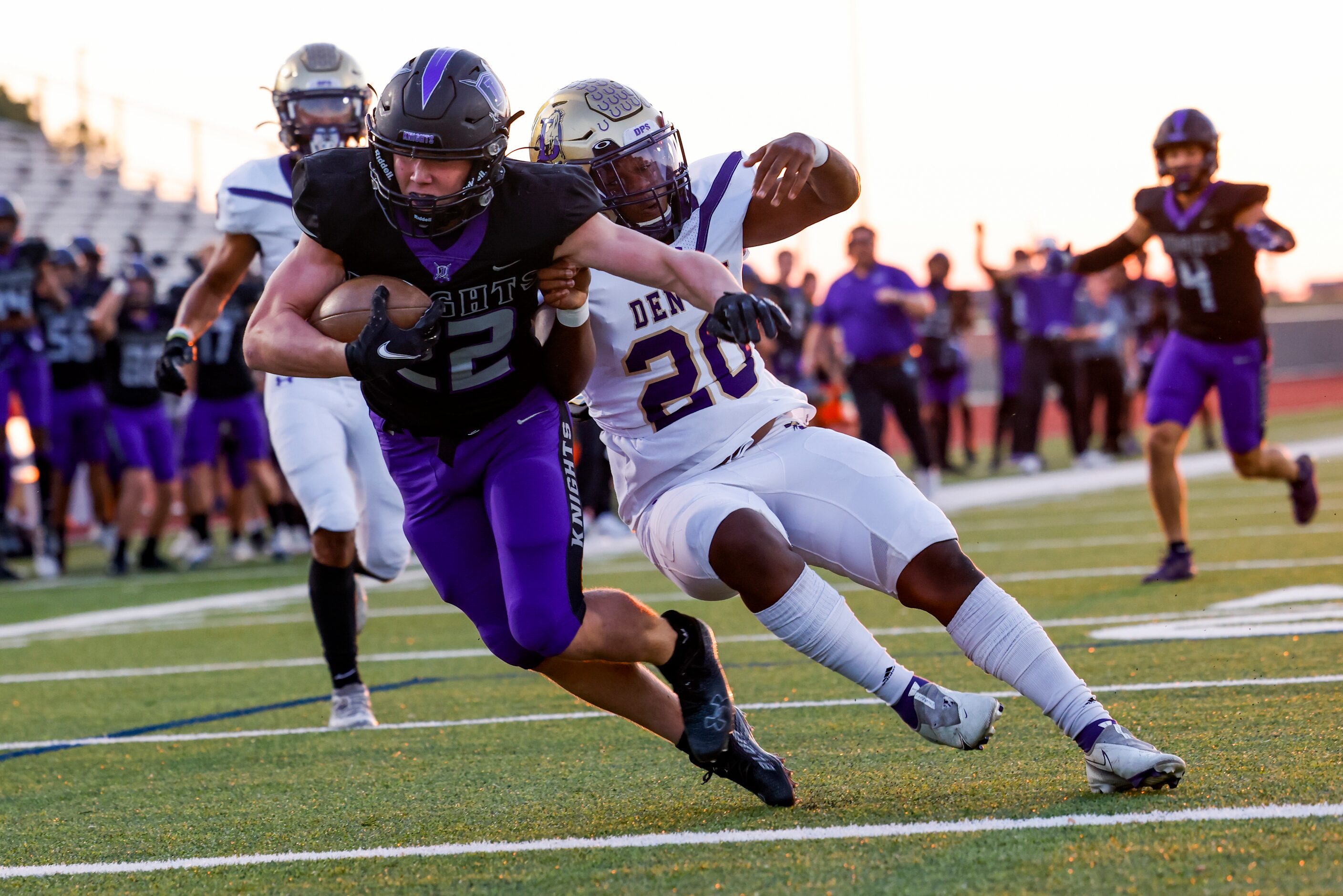 Frisco Independence’s Austin Call (22) runs past Denton’s linebacker Jacobi Gladney (20) at...