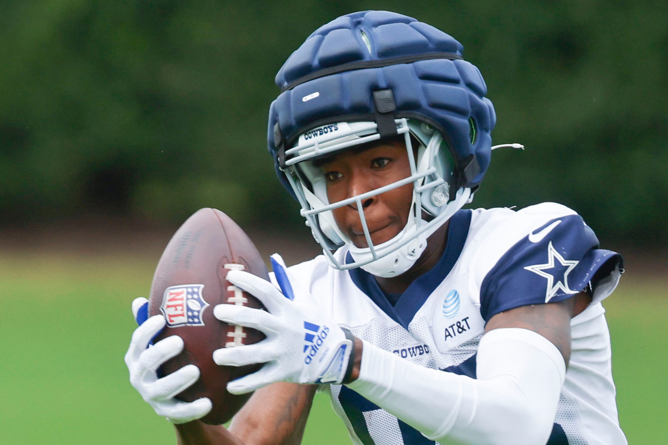 Dallas Cowboys wide receiver Jalen Brooks (83) receives a a throws as he takes part during a...