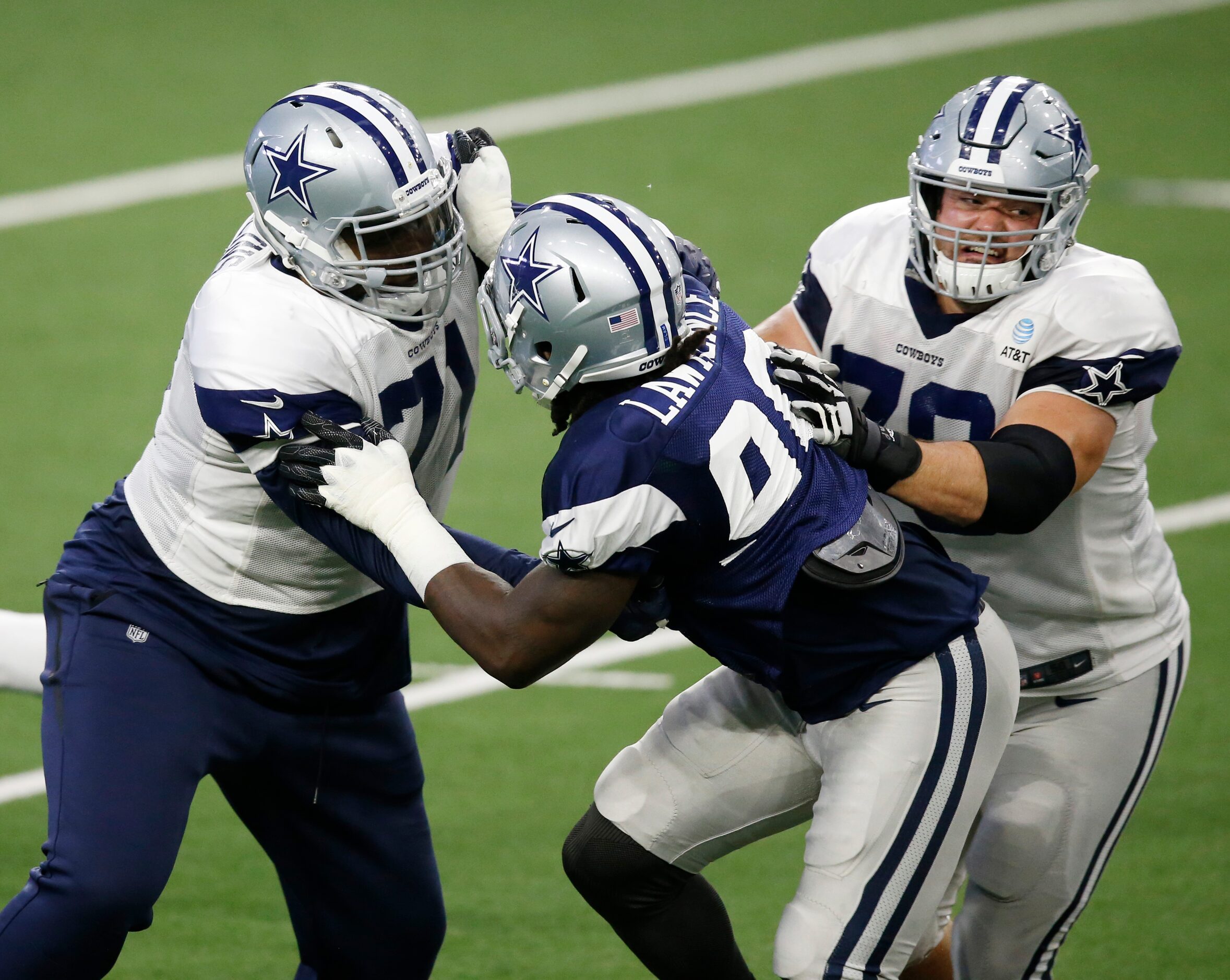 Dallas Cowboys offensive tackle La'el Collins (71) and Dallas Cowboys guard Zack Martin (70)...