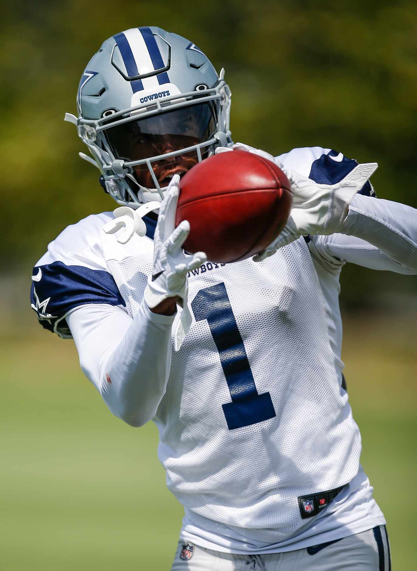 Dallas Cowboys wide receiver Cedrick Wilson (1) catches a pass during practice at The Star...