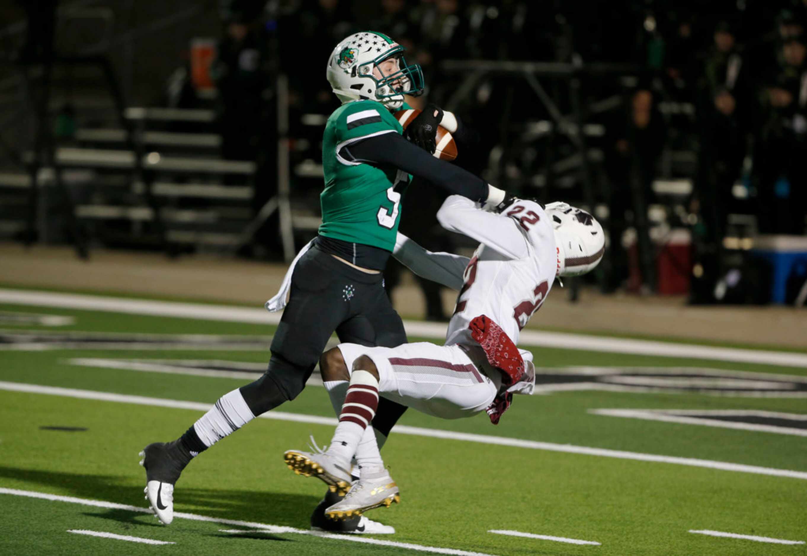 Southlake Carroll's Wills Meyer (5) makes a reception and forces his way past Lewisville's...