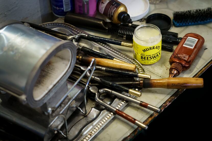 Earnestine Tarrant’s supplies and equipment are seen at her station in her hair salon on her...
