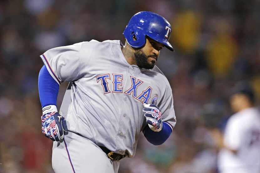 Texas Rangers designated hitter Prince Fielder rounds the bases on his two-run home run off...