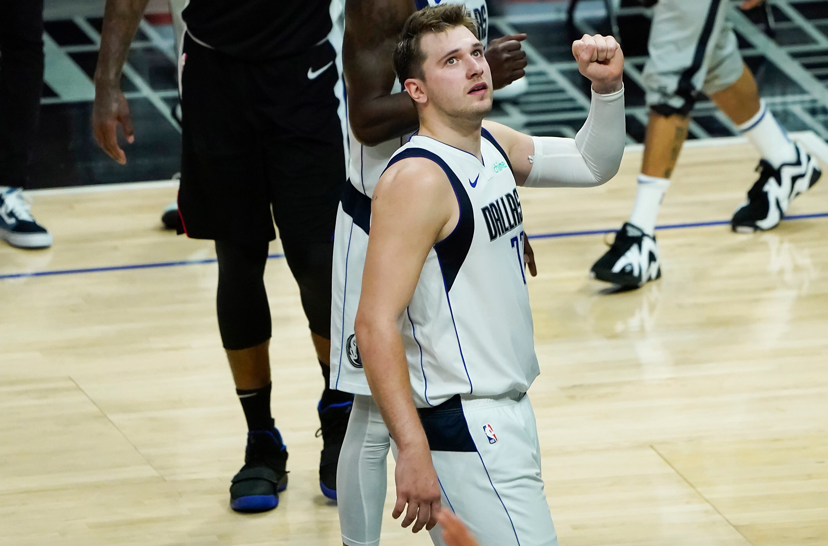 Dallas Mavericks guard Luka Doncic celebrates after the final buzzer of a win over the LA...