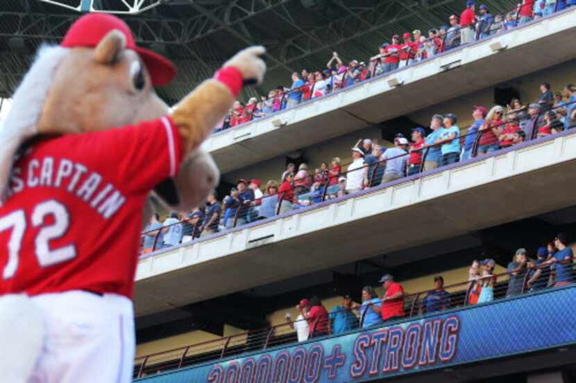 Texas mascot Rangers Captain acknowledges the fans during the seventh inning stretch during...