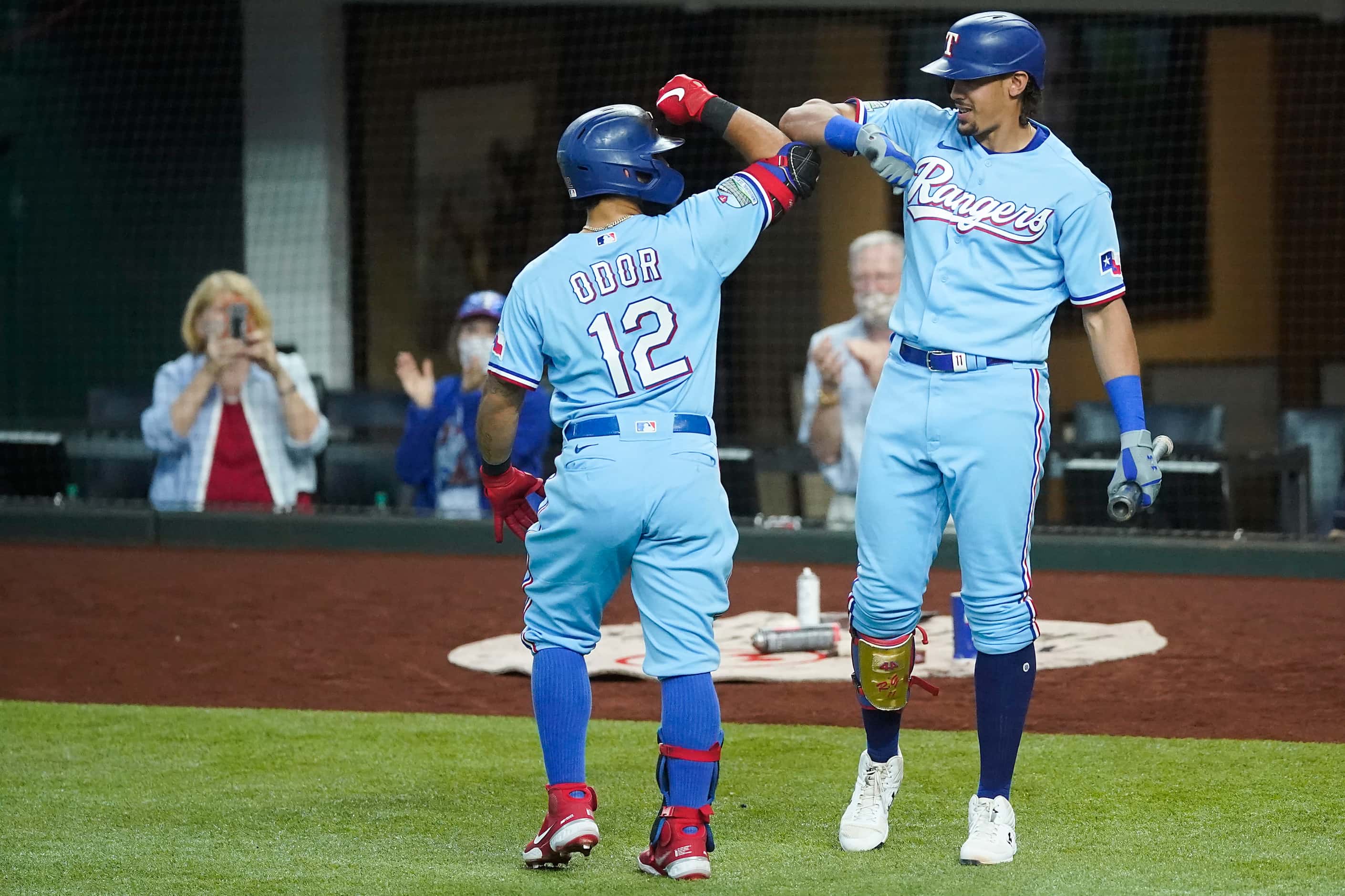 Texas Rangers second baseman Rougned Odor celebrates with first baseman Ronald Guzman  after...