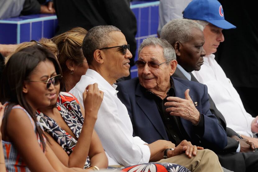 President Barack Obama and Cuban President Raul Castro attend an exhibition game between the...