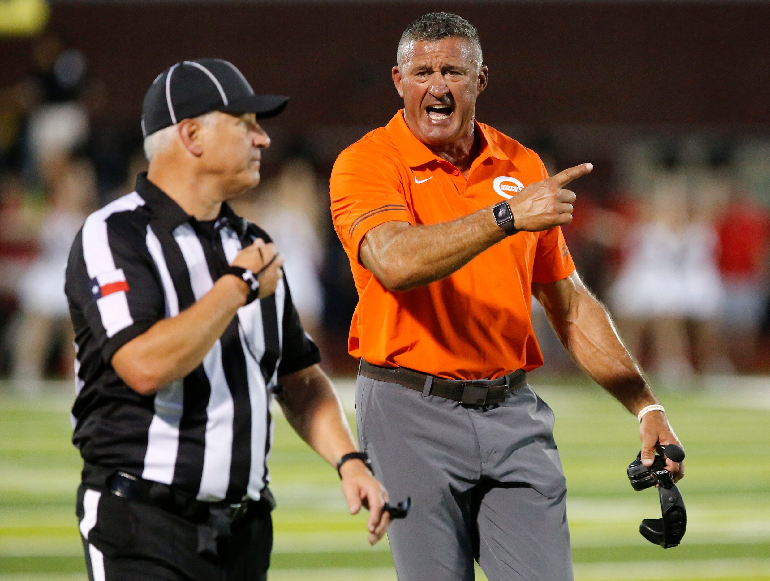 Celina High School head coach Bill Elliott questions why a touchdown was called back for a...