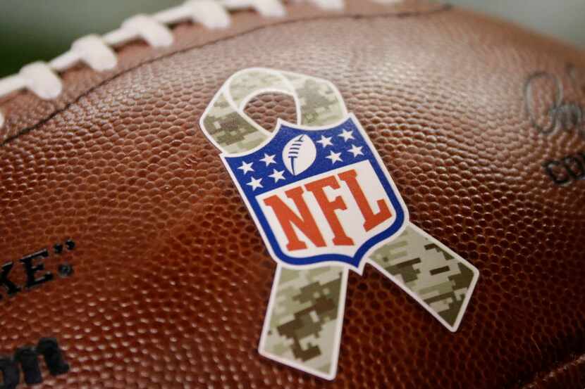The NFL Salute to Service logo adorns a football during the first half of an NFL football...