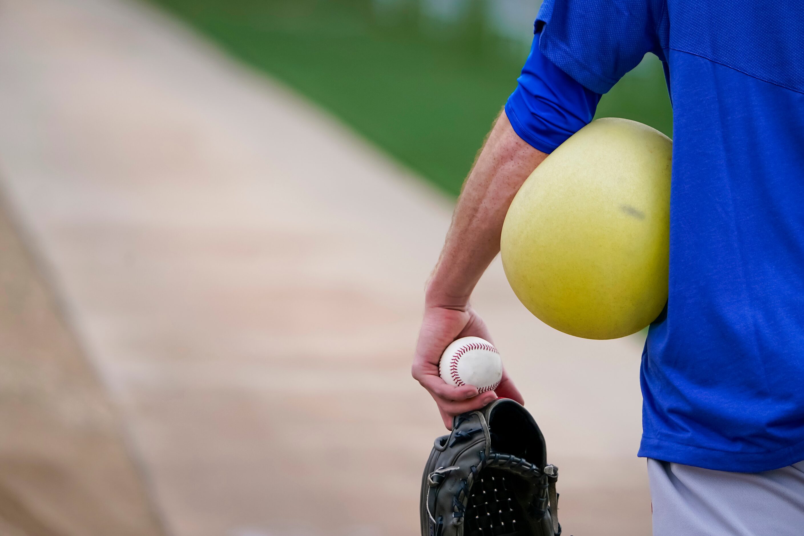 Texas Rangers pitcher Kyle Gibson carried his gear back to the clubhouse after throwing in...